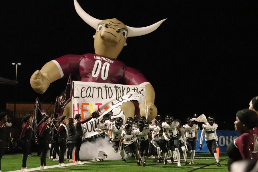 George Ranch football runs through the tunnel to kick off the first quarter.
