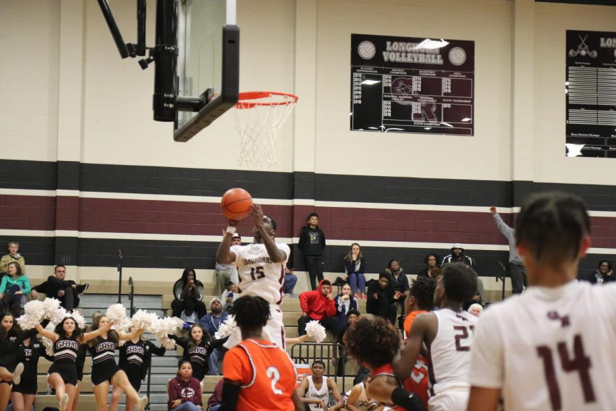 No. 15, AD Harris(12) makes the jump shot against Bush.