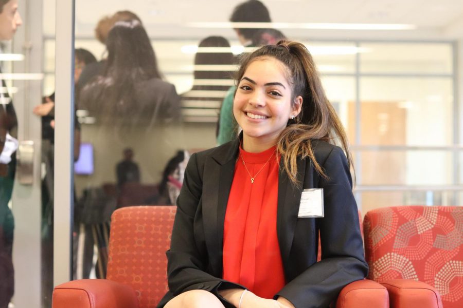 Lina stops for a quick picture on her way to lunch after Session Four of Conference.