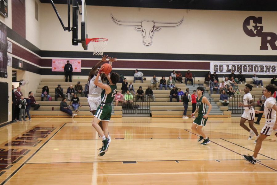 Ori Limbrick prevents the ball from being shot which will help them win.