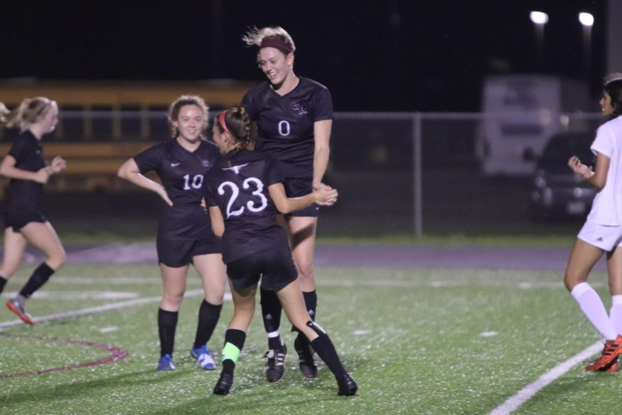 No. 0 Jenna Murray (12) and No. 23 Riley Grafe (12) celebrating the goal the two Longhorns made together.