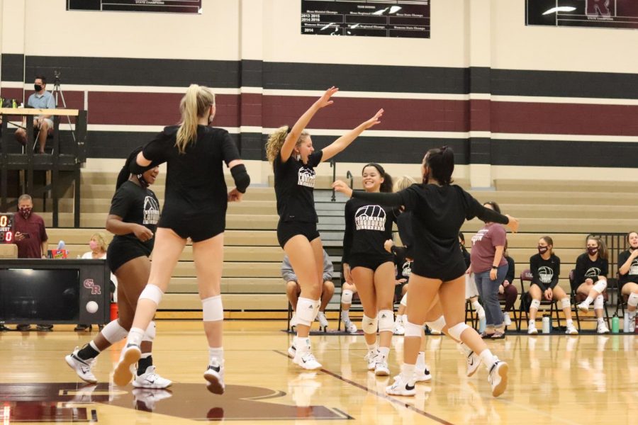 The varsity squad keeps the energy up in the last ten minutes of the scrimmage against Foster HS by hyping their teammates up after gaining a point. 