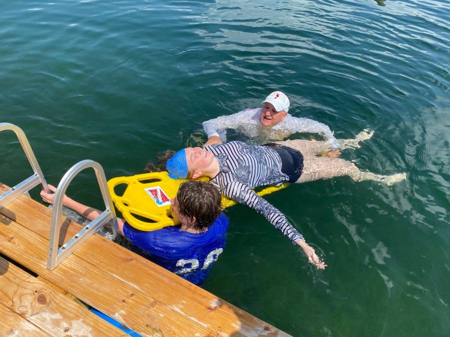 Laying on the board is Lauren Spencer who is taking a rescue diver class.