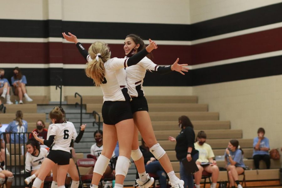 No 12. Logan Lednicky (11) and No. 18 Allie Sczech (11) performing their routine handshake before the game.