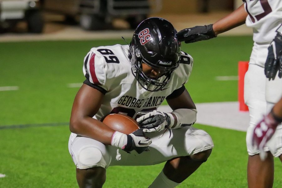 No. 89 Greg Hookfin (12) in uttermost shock of the play he just performed. Hookfin intercepted the ball from Taylor and took off to the Longhorns goal line.