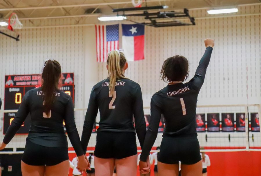 No. 3 Helen Watson (12), No. 2 Avery Shimaitis (11), and Alex Tennon (12), representing their team, stand as one whole.