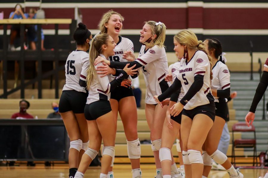 No. 7 Taylor Reeves (11) who is normally a defensive specialist, pulled a kill through for the winning point against Fort Bend Bush. Her team crowded around her with excitement. 