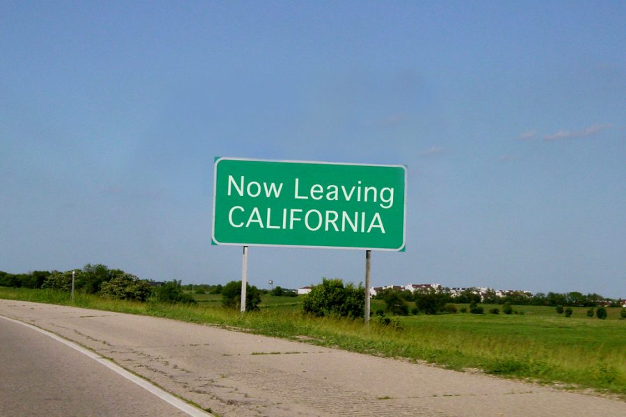 Road sign along the border of California as someone is leaving the state. 