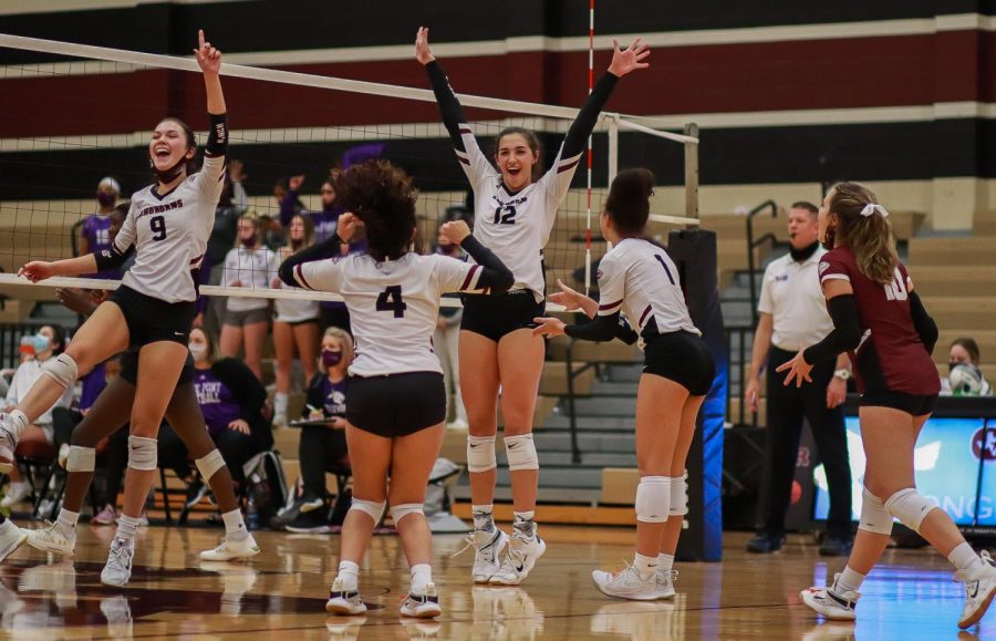 No. 12 Logan Lednicky (11) hands up with excitement after Lednicky successfully blocked the Panther's hit.