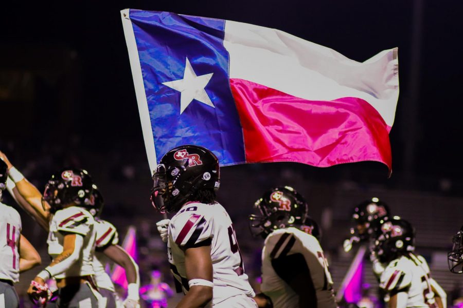 Every game the Longhorns carry the American flag and the Texas flag when flooding onto the field.