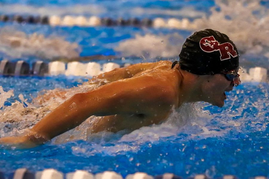 Nicholas Matt (12) competing in the boys 100m fly race. Matt finished the race in second place with a final time of 58.04.