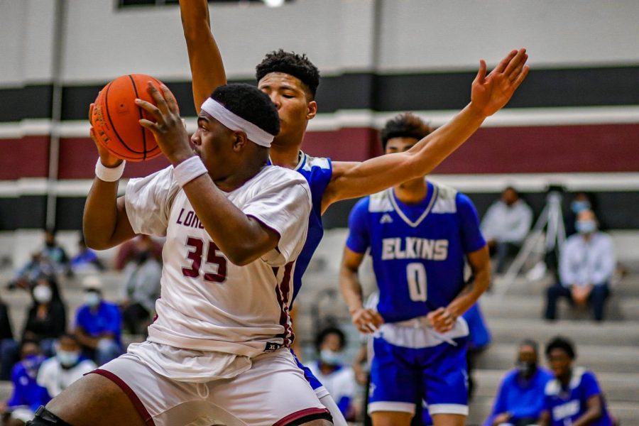 No. 35 Zion Harper (10) preparing to pass to a teammate after catching the ball off of the rebound