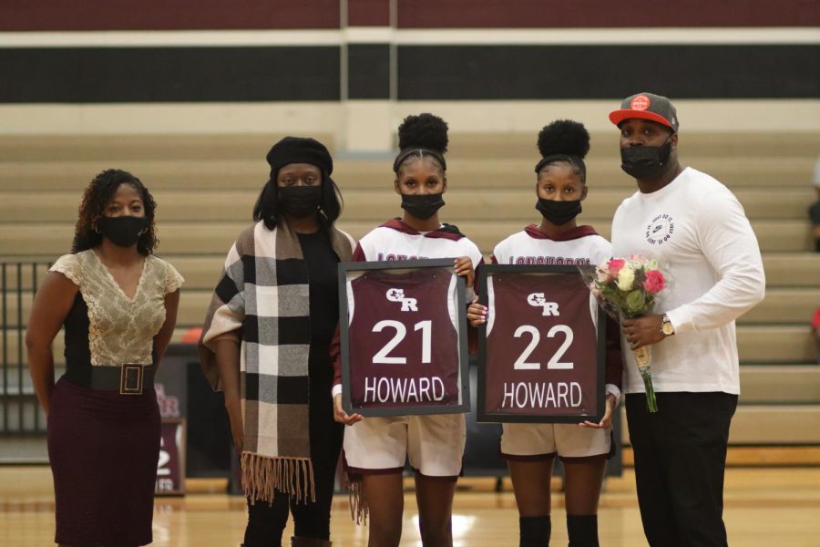 No. 21 Jada Howard (12) and No. 22 Jasmine Howard (12) being recognized for their contributions to the Girls Varsity Basketball Team.