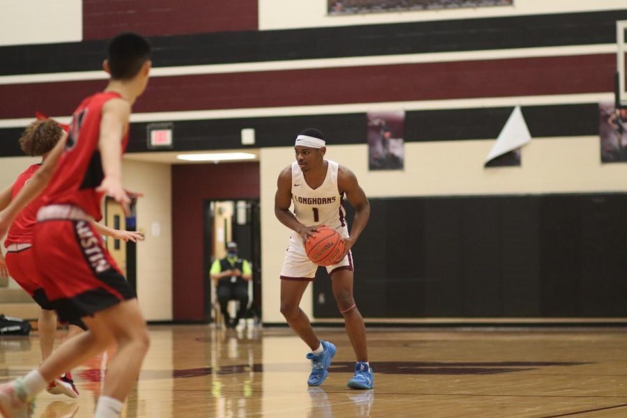 No. 1 Stephen Woods (12) was planning his next move against Austin.