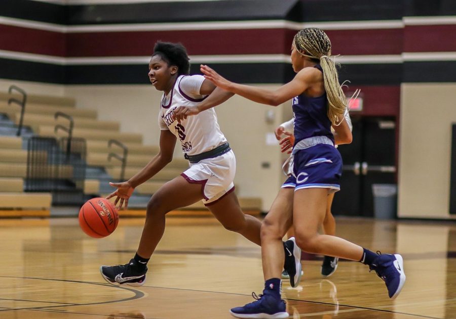No. 10 Rachel Okoye (11) taking long strides down the gym against the Clements' guard and to further attempt a layup.