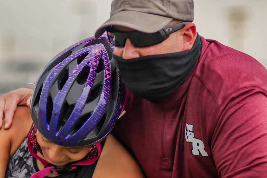 Skylar Herrera (10) and Coach Jones filled with joy after Herrera broke her personal and school record for the Wheelchair 400 meter race with a time of 1:36.23. Nearly 10 seconds faster than her last personal record.