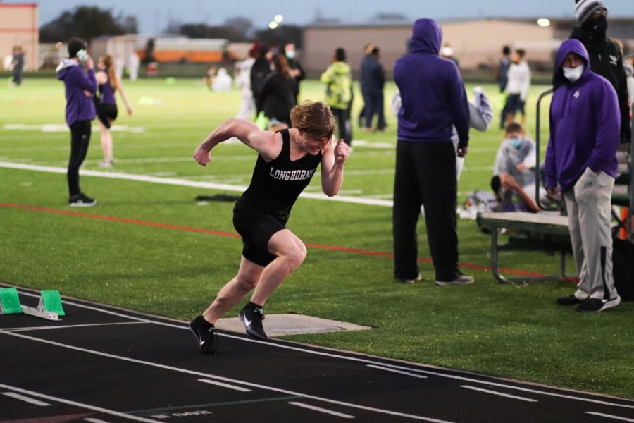 Cole Armstrong (9) went all out for the 400m. He came back with nothing left in him.