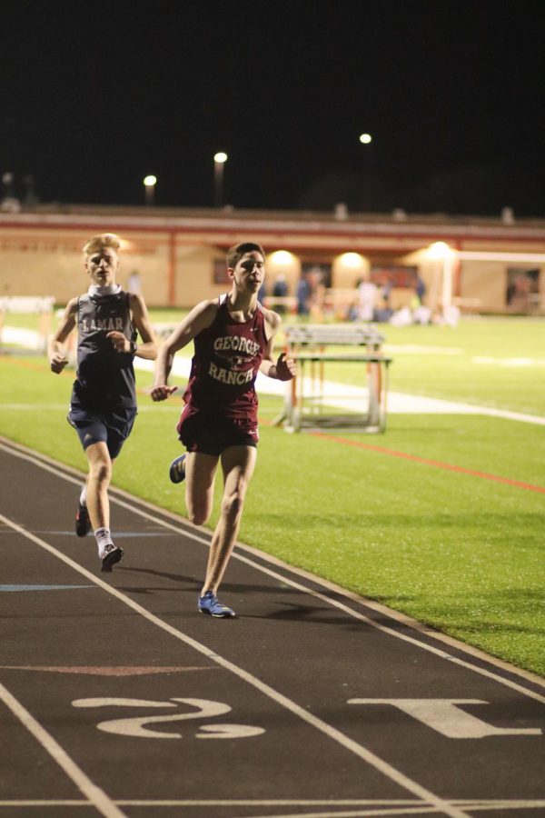 Ethan MacDonel (10) held a fast paste all through out the 1600m.