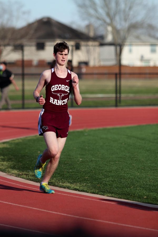 Grant Cummings (11) set a new PR of a total of 15 seconds less for the two miles. 