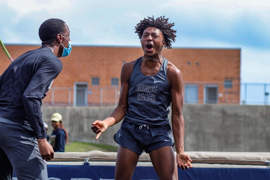 Shane Gardner (11) filled with extreme excitement immediately after tieing the boys high jump record for the Longhorns which is 64. 