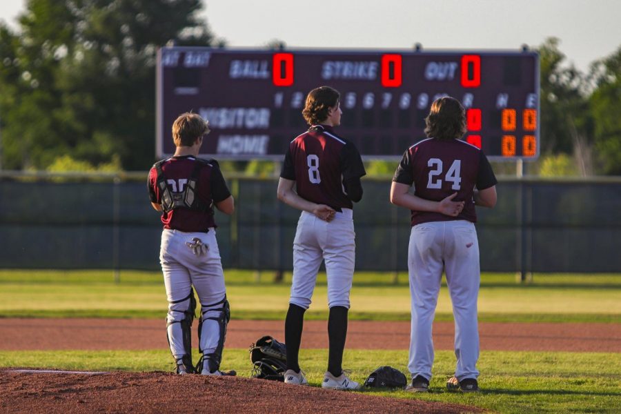 Will Krenek (12), Cole Murphy (11), and Reese Beheler (11) together for the Pledge of Allegiance.