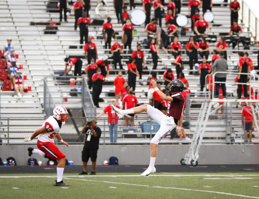 No. 12 Cole Murphy (12) punting the ball after receiving a second touchdown for the night. 