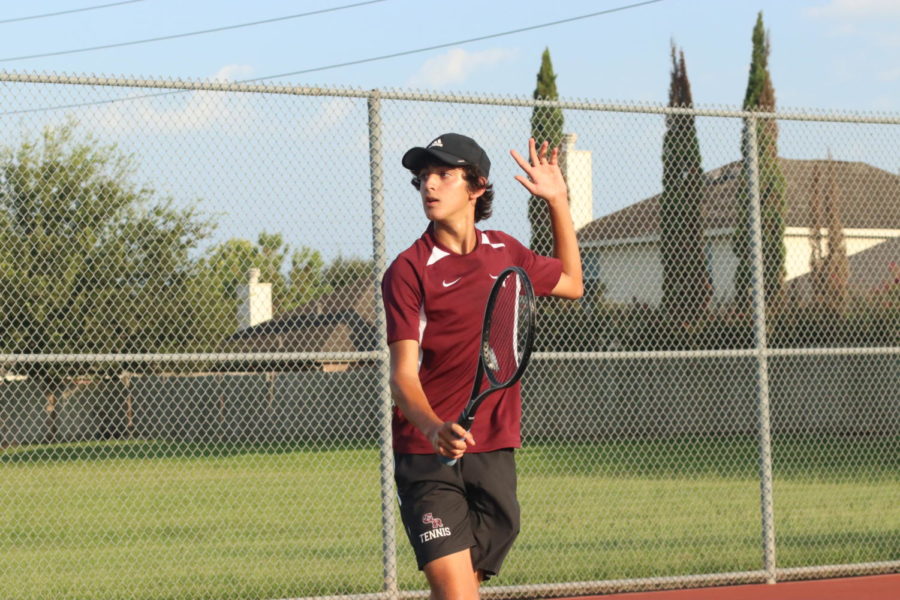 Santiago Allub (10) hitting a backhand volley after rushing the net.