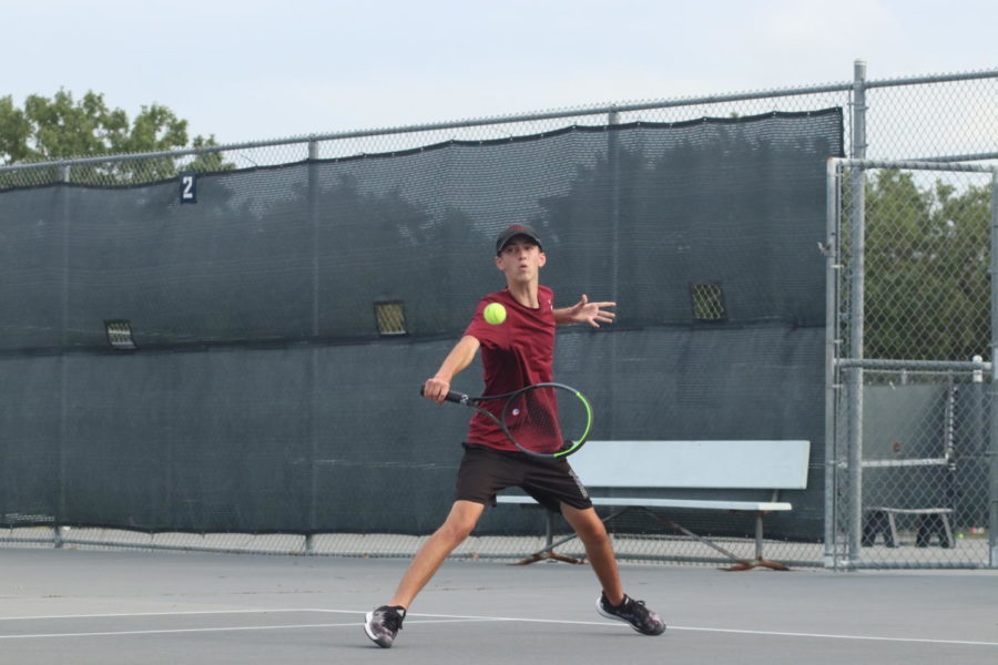 Hayden Gazaway (11) hitting a slice back over the net.