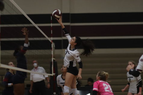 No.7 Ivanna Martinez (11) spiking the ball to the other team.