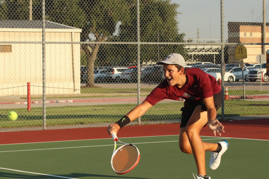 Cristian Johnson (12) reaching for a low volley.