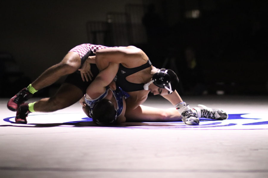 Chicken Wing! Samad Al-Khatib (12) Getting a Chicken wing to pin Episcopals wrestler.