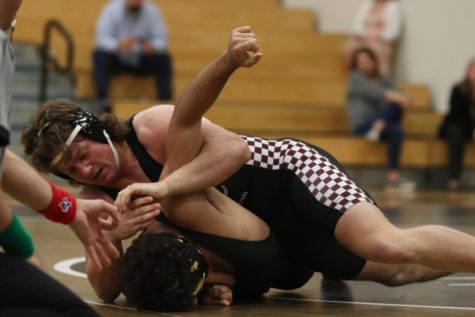 Power half! Judson Mixon (12) attempting to get a half and crank it to get a pin.