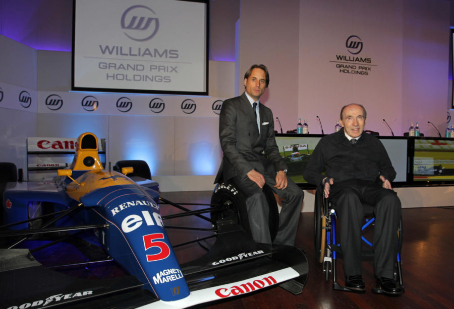 Frank Williams (right) next to Nigel Mansell's 1992 Championship winning car.  