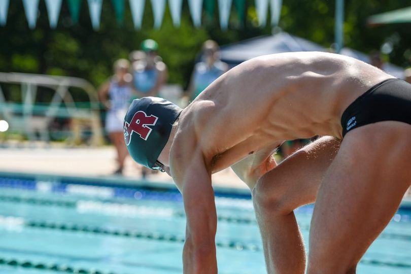 Tuttle drowns out the noise of the crowd as he prepares himself for his event. 