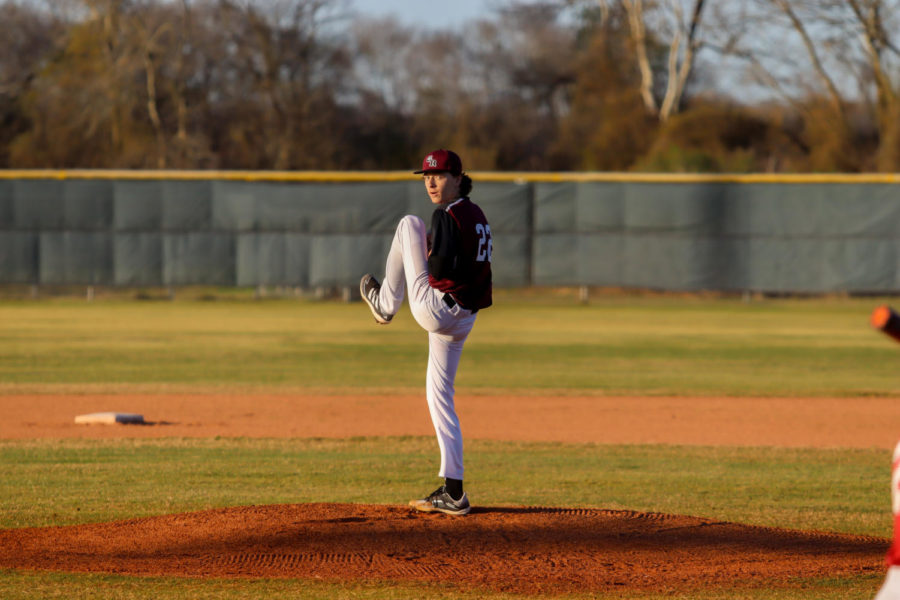 No. 22 Logan Waston (11) moments before he pitches the ball.