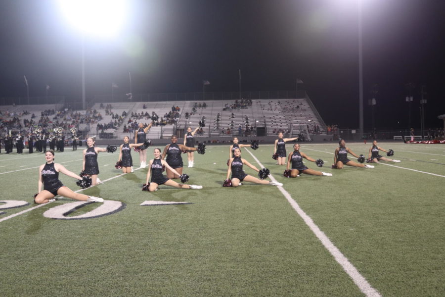 The Belles on the field in their ending psoe. 