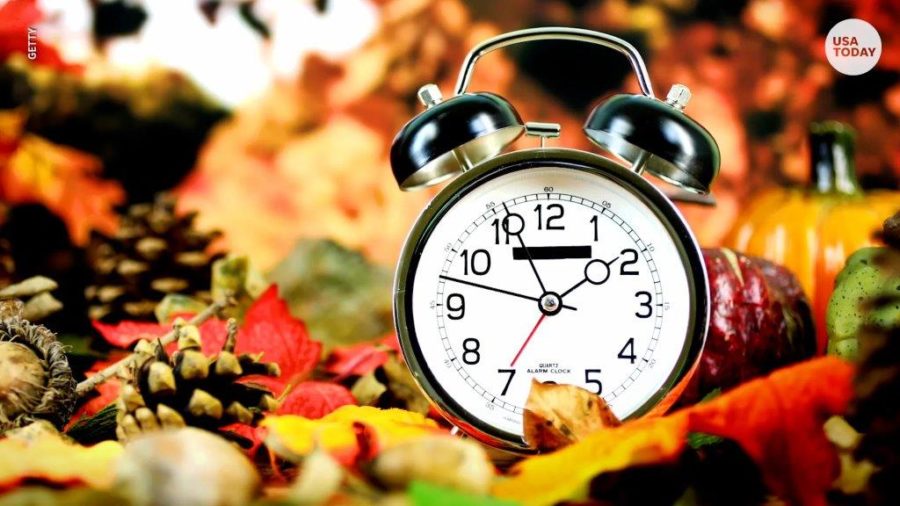 A clock in fall weather.
